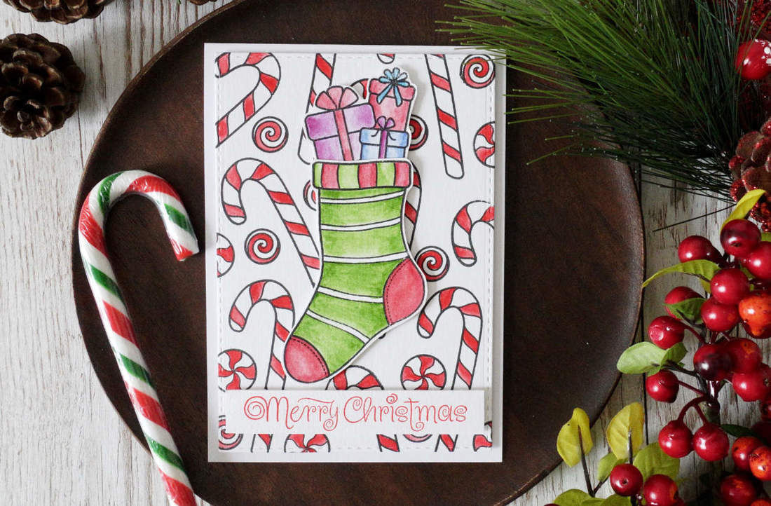 Handmade Christmas Card. 12 Cards For Christmas 2018 - Card 2. Background stamping and Christmas stockings. Using watercolours from Winsor & Newton and Sweets & Treats stamp set by Create A Smile. #cherrybeecards