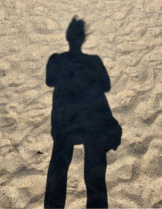Shadow of myself in the sand.
