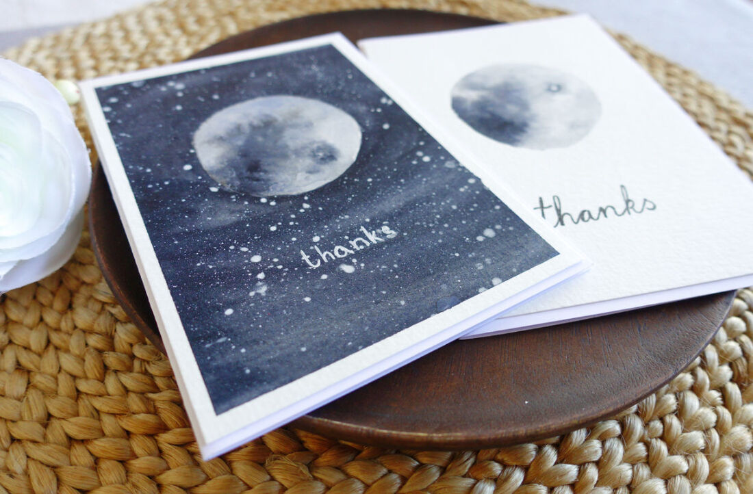 Simple card with watorcoloured moon. One with just white background the other with dark starry sky.