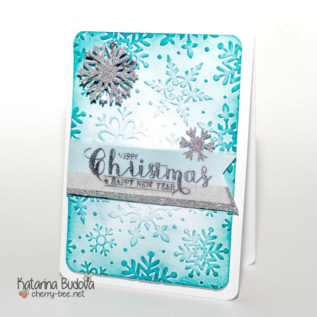 Handmade Christmas card with dry embossed snowflakes and distress background.