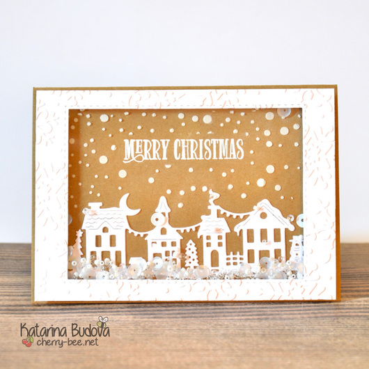 Handmade shaker card for Christmas Holidays with Christmas village and snowy sky.