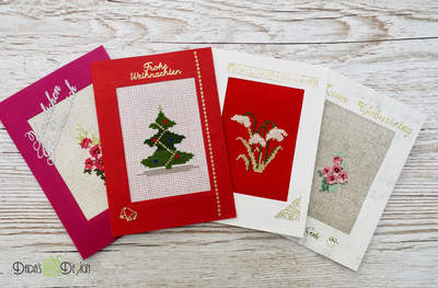 Handmade Christmas Holiday card using cross stitched designs made by Dada Husar.