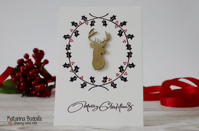 Handmade Christmas Holiday Card using a Fa La La Stamp Set from Avery Elle and a head of a deer die-cut from Newton’s Nooks Designs called Splendid Stags Die. The wreath is stamped with a black Versafine ink and the deer is heat embossed with golden embossing powder from Wow.
This creates a beautiful jet very simple Christmas card, that is also rather on the masculine side.