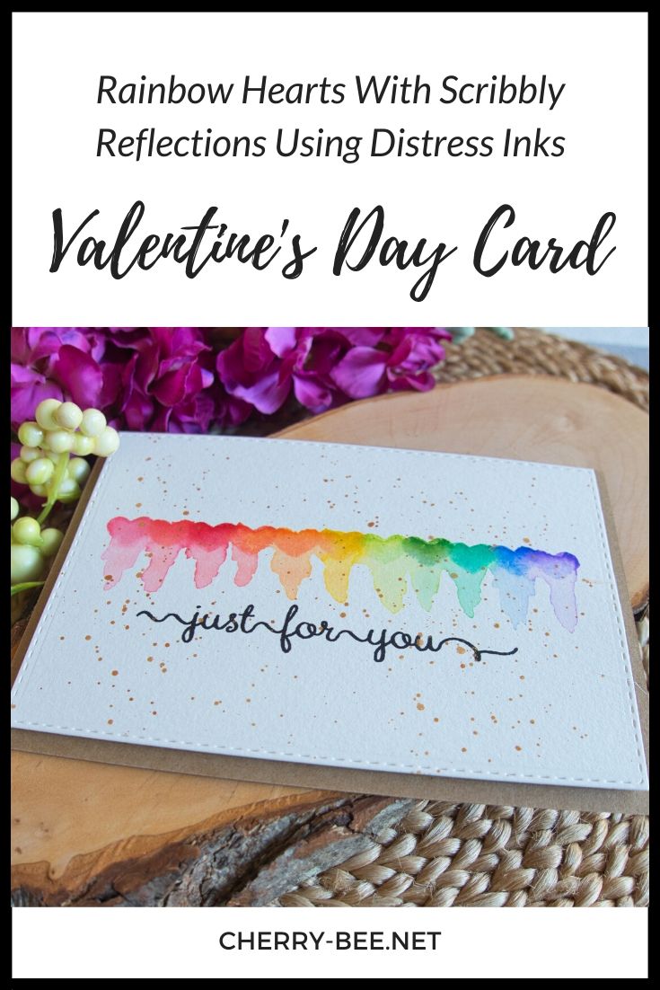 Card for Valentines day, with rainbow hearts with messy reflections using distress inks. #cardmaking #HandmadeCard #cardtutorial #ValentinesDayCard #ValentinesDayGift #anniversarycard #anniversarygift #distressinks #watercolourreflections